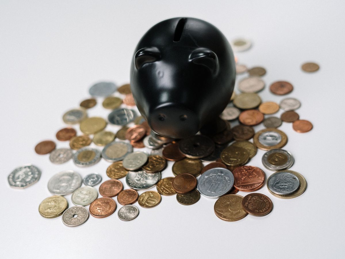Coins and a piggy bank representing fair, affordable tutoring fees