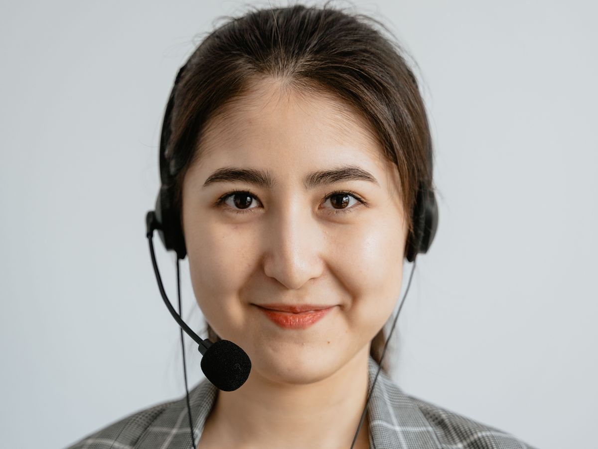 Friendly NovaTutors support team member wearing a headset