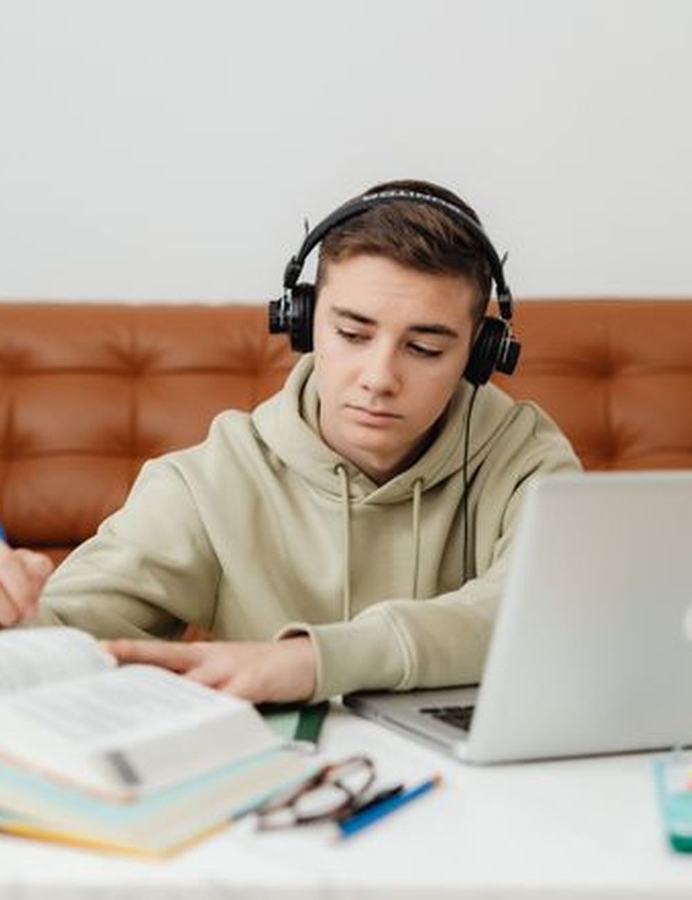 Tutor helping a student with homework over video call